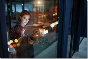 Cropped shot of a young businesswoman working late on a digital tablet in an office