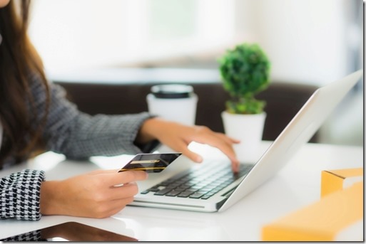 Portrait beautiful young asian woman use credit card with laptop for online shopping