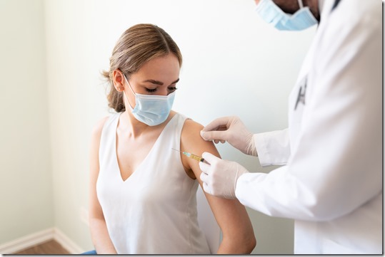 Cleaning up patient's arm for a vaccine