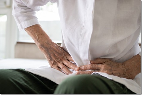 Sick senior patient having aching belly,hands hold stomach,stomachache,old people with symptoms gastrointestinal system disease,crampy abdominal pain hurt in stomach caused by indigestion or diarrhoea